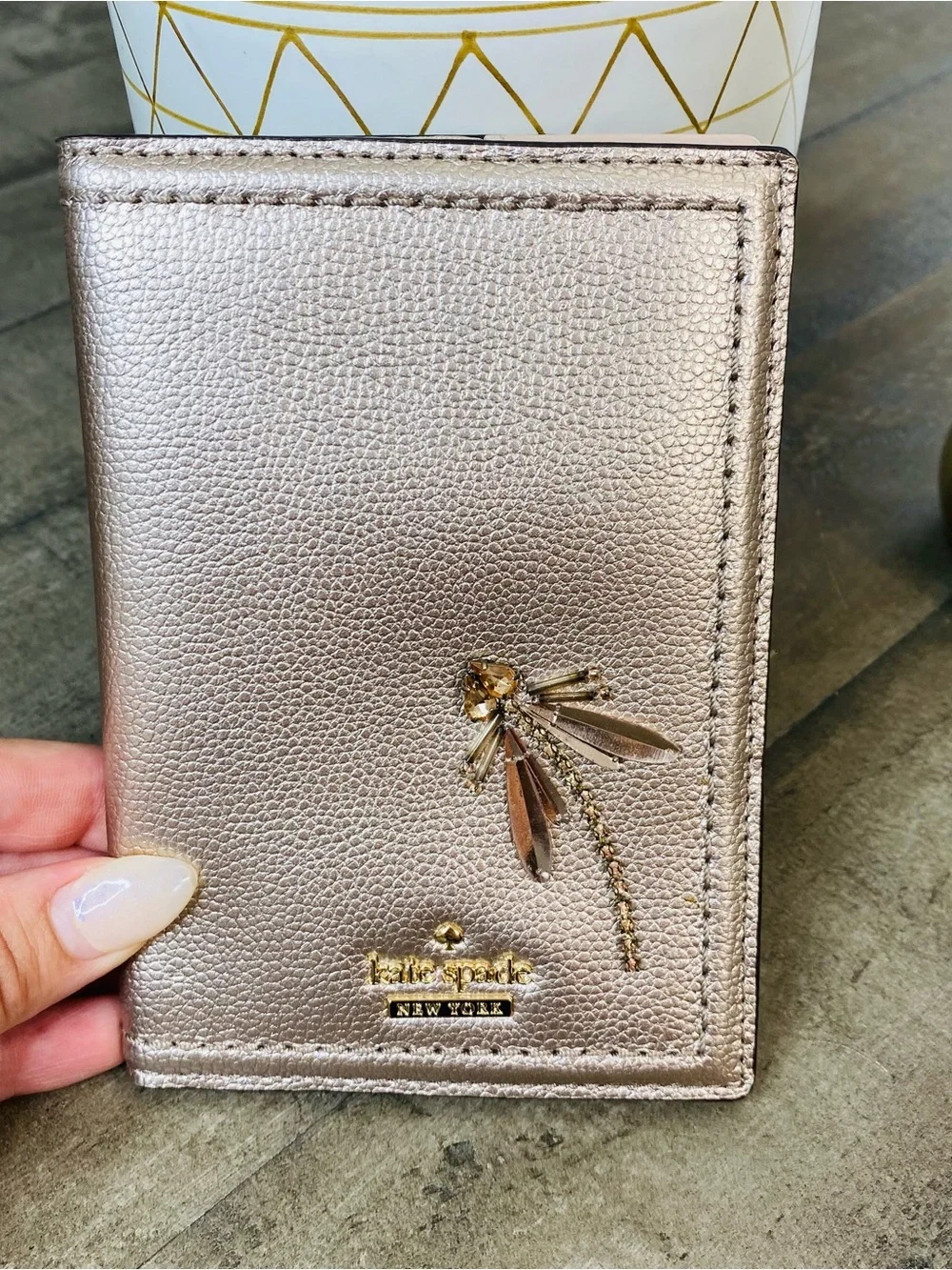 Kate Spade New York Imogene Dragonfly Passport Case Rose Gold Metallic